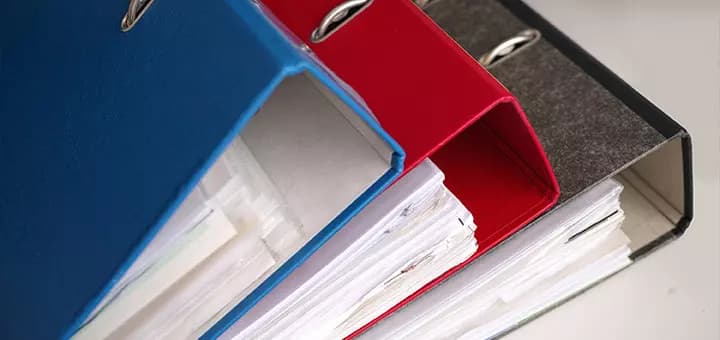 Physical folders representing manual legal filing problems